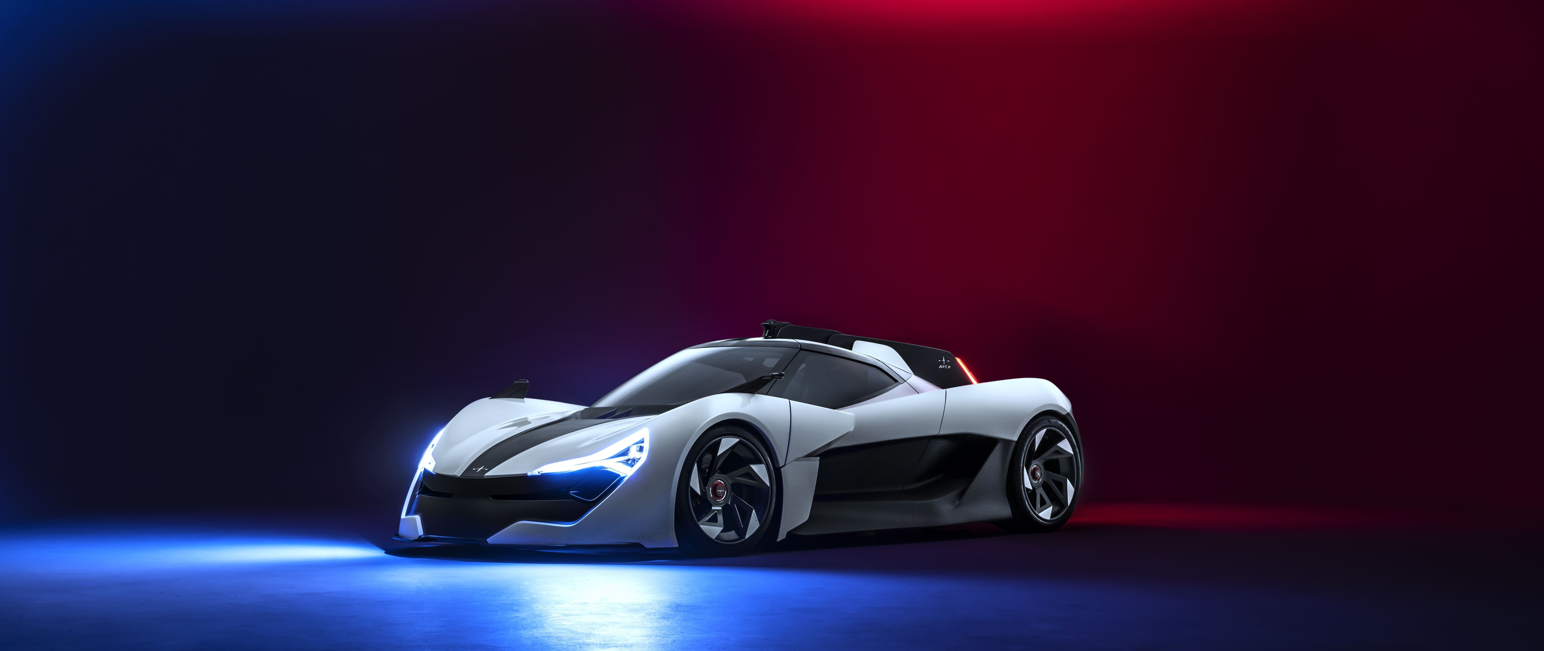 Elegancki, aerodynamiczny, nowoczesny samochód sportowy, zaprezentowany w profesjonalnym studiu fotograficznym.